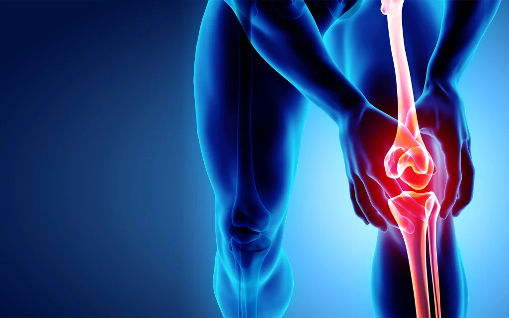 chronic joint pain leg | Dr. Paul Macnamara consulting a knee replacement patient in Dubai